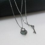 silver-toned lock and key pendant necklace